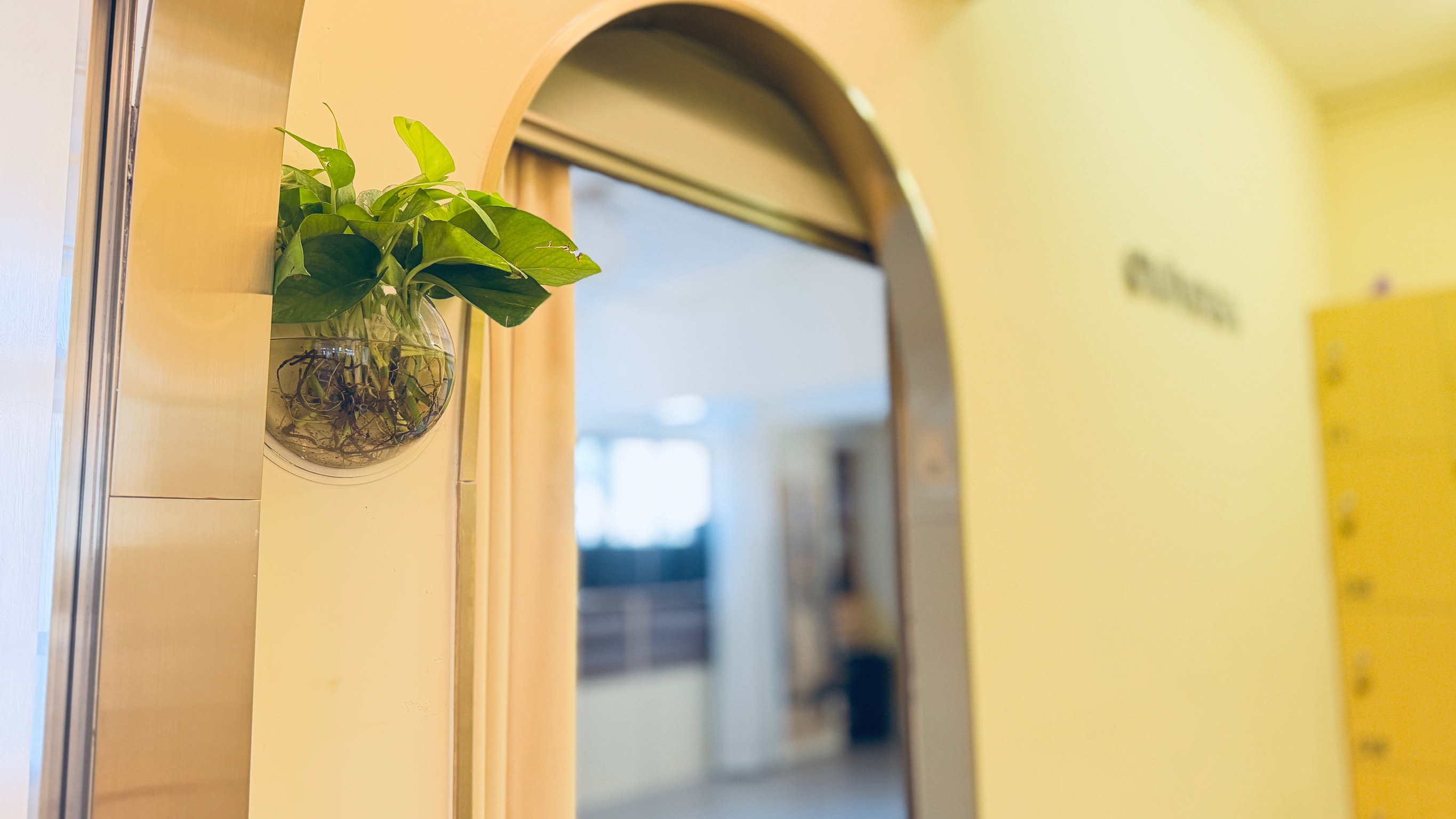 A warm archway inside the OMIYOGA studio